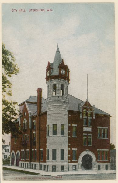 Exterior view from street of the City Hall with clock tower. Caption reads: "City Hall, Stoughton, Wis."