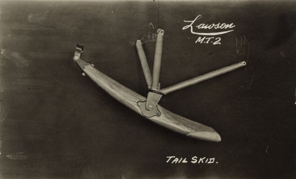 Photographic postcard  with a close-up shot of the tail skid Alfred Lawson designed for his Military Tractor 2 (MT2), one of his first airplane designs.