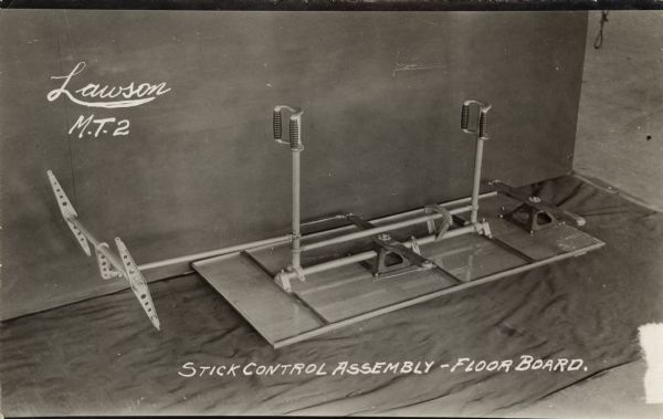 Photographic postcard showing the stick control assembly for the Lawson Military Tractor 2 (M.T.2), attached to the floor board of the plane.