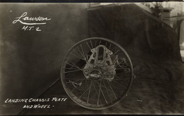 Photographic postcard showing the landing chassis plate and wheel for the Lawson Military Tractor 2 (M.T.2).