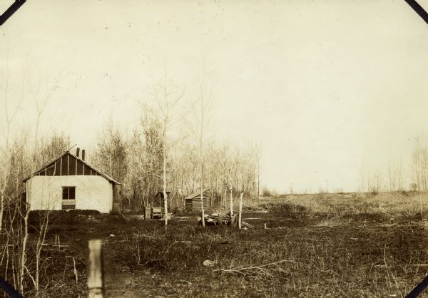 View of the dilapidated farm from which the Brundage family moved with the assistance of The United States Resettlement Administration.