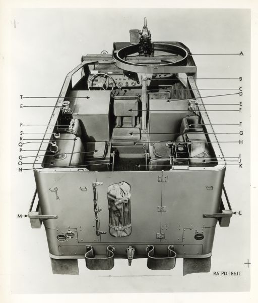 View from rear of a half truck with the top open and parts labeled with the letters "A" through "T."