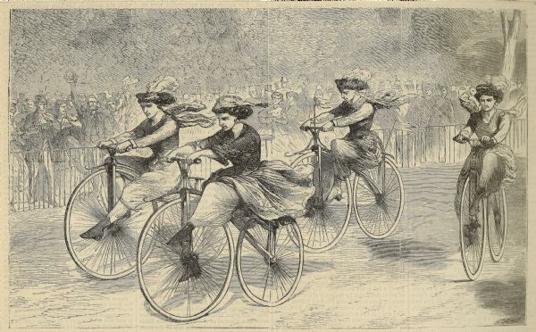 Engraved view of four women racing on bicycles. Spectators in the background are behind a fence.