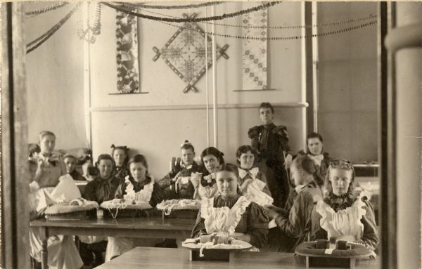 Young women practicing fine sewing and lace making at Wisconsin Home for the Feeble Minded.