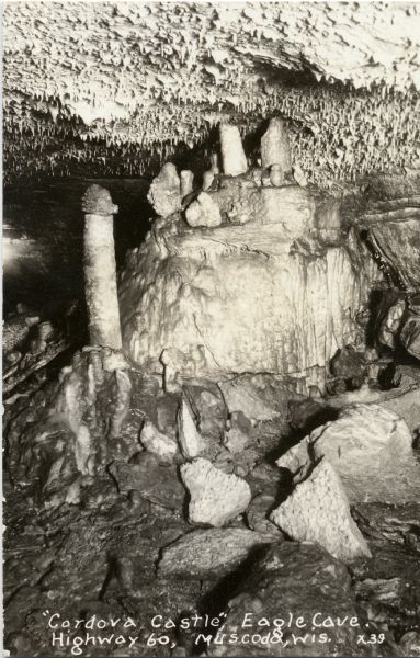 Postcard view of rock structure known as Cordova Castle in Eagle Cave. Caption reads: "'Cordova Castle,' Eagle Cave, Highway 60, Muscoda, Wis."