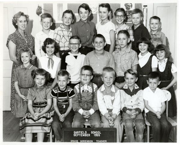 Group portrait of first through eighth grade students at Garfield School, with their teacher, Grace Sorenson.