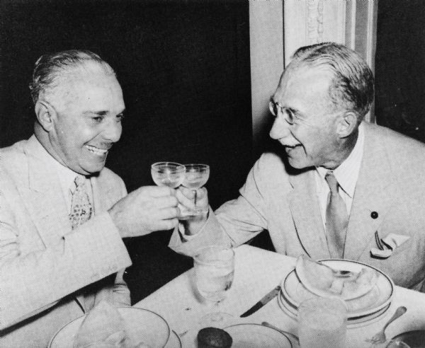 Rafael Trujillo, dictator of the Dominican Republic sharing a toast with Senator Theodore Green, Chairman of the Senate Foreign Relations Committee.