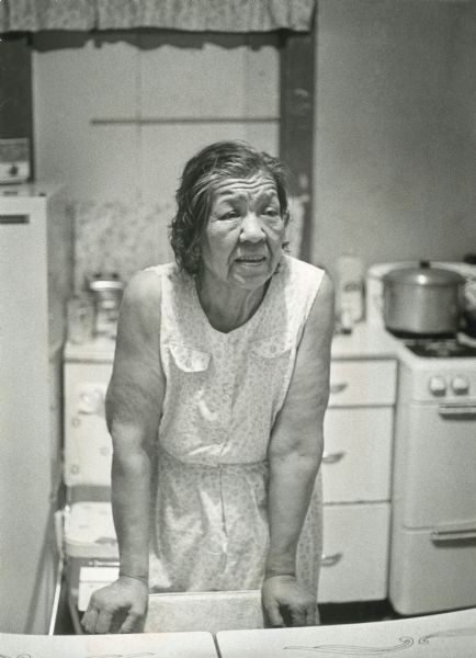 A candid portrait of Olivia King in her kitchen at their home on Rabbit Ridge on the Menominee reservation.
