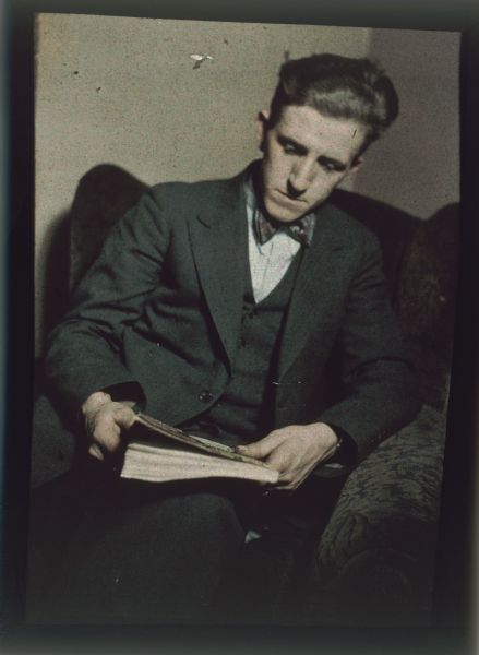 Autochrome of Angus McVicar, married to Genevieve Milward, seated in a chair.