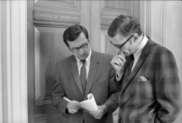 Wisconsin Congressman David R. Obey and his administrative assistant Lyle Stitt outside the office doors for the Committee On Appropriations.