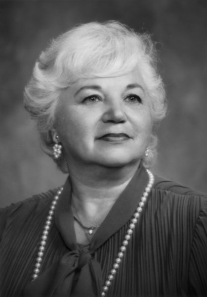 Quarter-length portrait of Gene Boyer, a founder and the first treasurer of the National Organization for Women (NOW).
