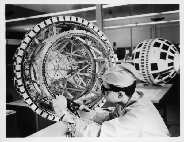 A technician prepares the ends of cable wires in the Telstar satellite.