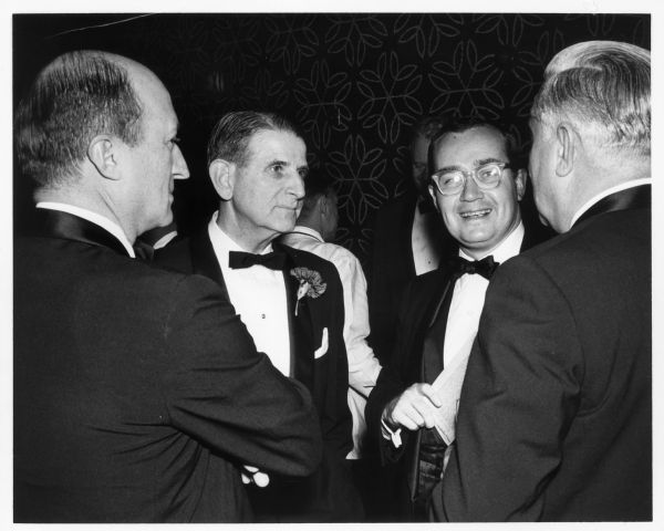 Newton Minow, second from the right, talks with other men at the 12th Annual Silver Quill Dinner.