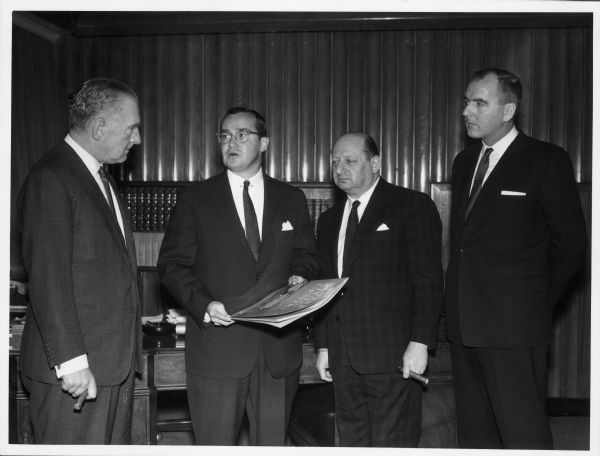 Newton Minow, second from left, joins other men in London in the office of Associated Television Ltd.