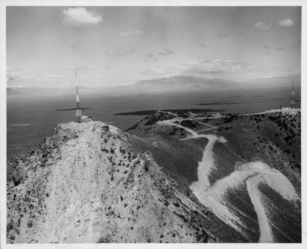 Aerial view of two radio and television transmitters atop a butte in the Arco-Snake River desert.