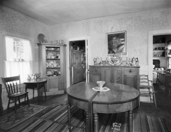Dining room decorated in 1840s style in Ralph Warner's "The House Next Door," aka the Lovejoy-Duncan House, 11219 N. Webster Street. The pantry is seen through the open door on the right.