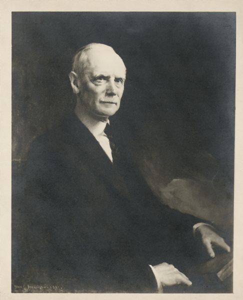 Waist-up seated portrait of Judge Arthur Loomis Sanborn.