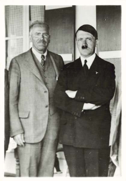 H.V. Kaltenborn poses next to Adolph Hitler at Berchtesgaden, where Kaltenborn interviewed Hitler.
