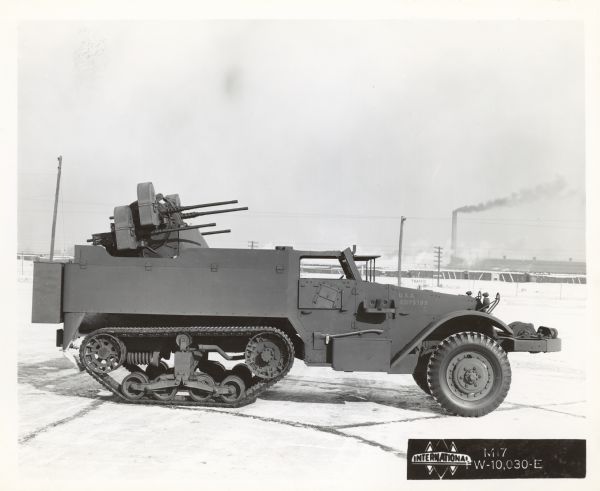 A view of the right side of an International Harvester half-track M17 parked outdoors.