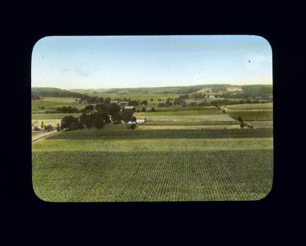 Elevated view of a farm, fields and hills near River Falls.