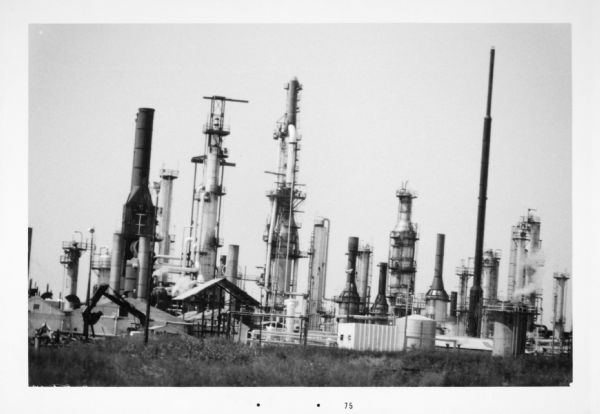 View across field towards the Superior Refinery, which operated under the name Murphy Oil Corporation at another time.