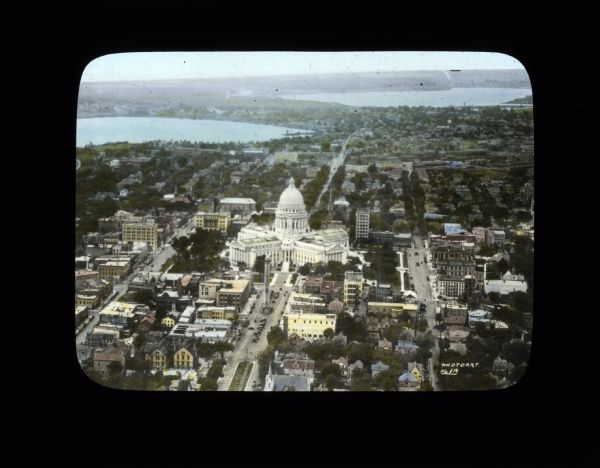 Aerial view looking southwest towards the Wisconsin State Capitol on the Capitol Square. Lake Wingra and Lake Monona are in the background.