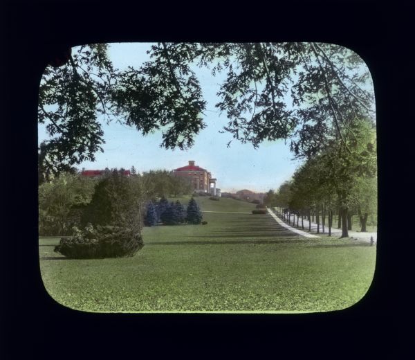View across a vast lawn of a building on the UW-Madison campus. The building is probably Agriculture Hall.