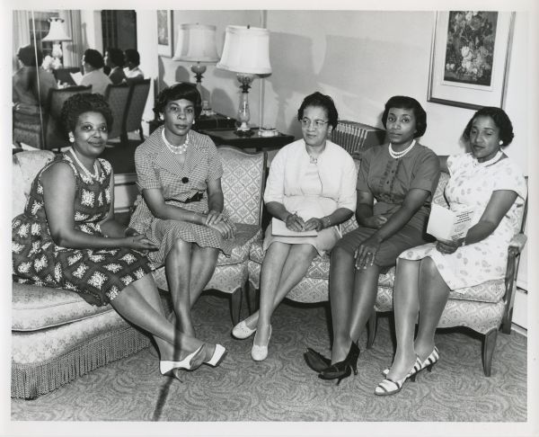 The NAACP Milwaukee Branch's Freedom Fund Dinner Committee. The Freedom Fund Dinner is an annual NAACP fundraising event and awards ceremony for the organization's scholarship fund. This group portrait is of five members of the committee (from left to right): Mrs. Bernice K. Rose; Mrs. Wilhelmina F. Hardy; Mrs. Ardie A. Halyard, chairman; Mrs. Helen M. Reed; and Mrs. Ola Lamkins. The caption also lists members not present: Mrs. Winifred White; Mrs. Ida Holloway; Mrs. Frances Starms; and Mrs. Vel Phillips.