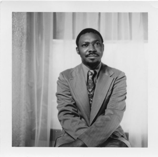 Waist-up portrait of Dr. Joseph Carpenter, assistant professor of Afro-American Education & Philosophy, posing wearing a suit. This image accompanied publicity material for his 1973 campaign for a seat on the Milwaukee School Board.