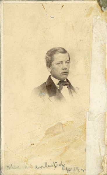 Head and shoulders vignetted portrait of William Upham, taken when he enlisted in the army at the age of 19.