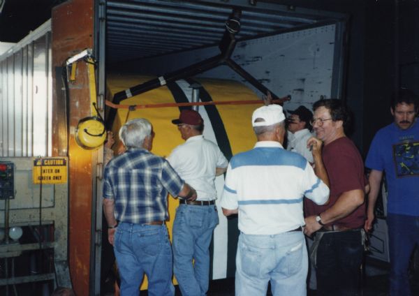 Bill Casper (red hat) and staff and volunteers from the Wisconsin Arts Board, loading Casper’s iconic Green Bay Packers ice shanty for shipment to the 1998 Smithsonian Folklife Festival on the National Mall in Washington, D.C. 
