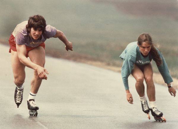 Siblings, Eric and Beth Heiden training outdoors for Olympic speedskating on rollerblades.