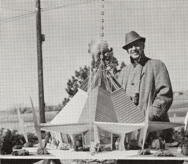 Outdoor portrait of architect John Steinmann with his model of the Wisconsin Pavilion for the 1964 New York World's Fair.