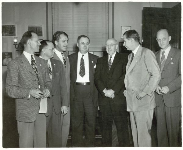 The opening of the campaign for the Full Employment Bill of 1945 was attended by, from left to right: Ted Silvey, Chairman of the Reconversion Committee CIO; W.G. Flinn, Representative of the Grand Lodge of the Association of Machinists, AFL; James G. Patton, President of the National Farmers Union; Representative Wright Patman; Senator Elbert Thomas; Senator James E. Murray, and Reinhold Neibuhr, chairman of the Union for Democratic Action/Americans for Democratic Action.   