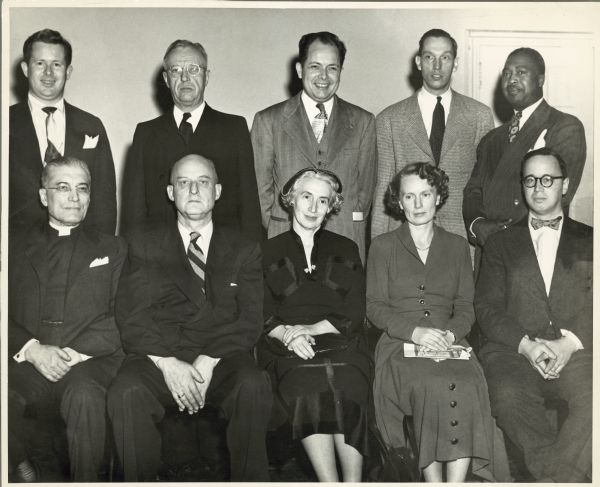 Reinhold Niebuhr (seated on the far right) posing with other attendees of the Americans for Democratic Action national board meeting.