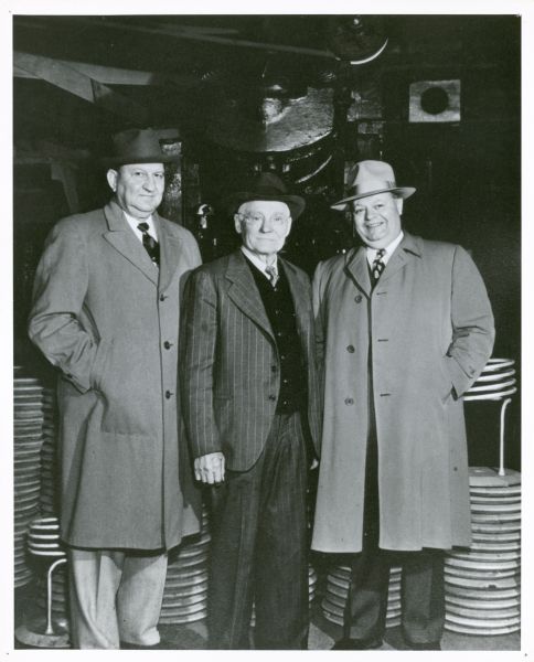 Three local businessmen who are friends pose together. From left to right are: Karl H. Fauerbach of Fauerbach Brewing Company, Frank J. Hess of Hess and Sons Cooperage, and Donald Huseby.