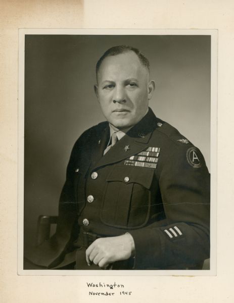 Waist-up studio portrait of Robert Allen in his military uniform. 