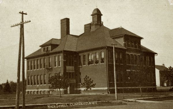 View from street towards the high school. Caption reads: "High School, Clintonville, Wis."