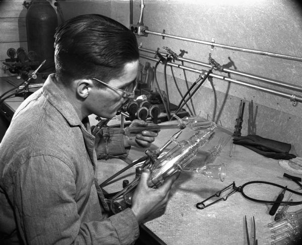 Glassblower Norman Erway working on a glass piece.