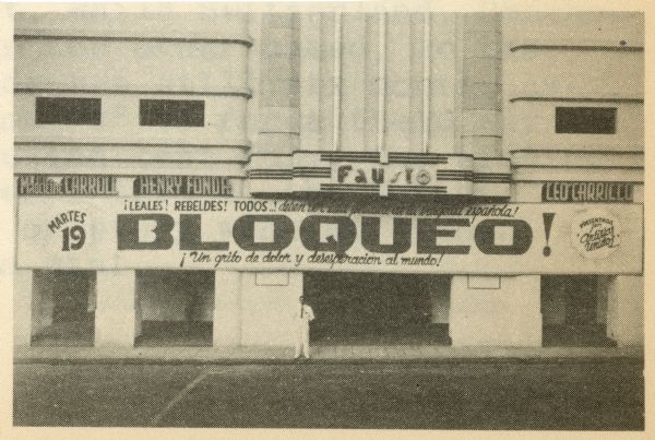 Movie theater marquee in Havana, Cuba advertising the 1938 film "Blockade" starring Henry Fonda. There is a man dressed in white standing on the sidewalk below the marquee.