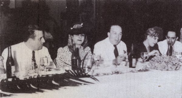 Henry Weiner, United Artists manager in Cuba, is honored for his twenty years with the company. He is sitting at a table with his wife along with Ernesto P. Smith, Militza Korjus and Valdez Rodriguez.