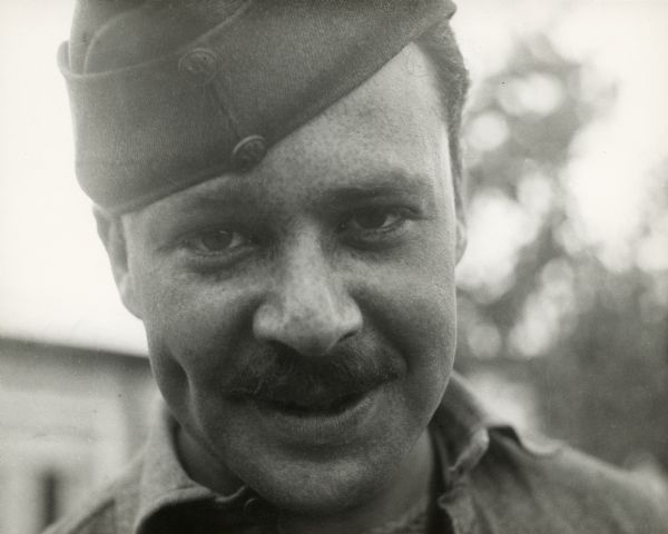 Close-up of Walter Wanger when he was in the Army during World War I. He has a mustache and his hat is tilted on his head.