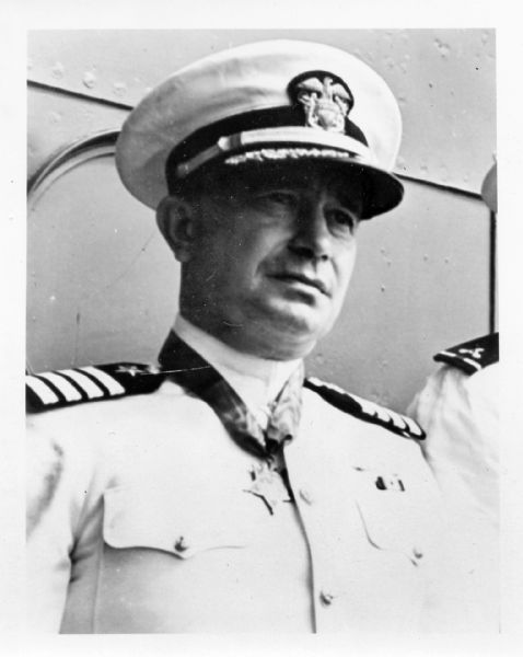 Image of Captain Cassin Young after having received the Medal of Honor. Captain Young received the medal for his actions during the attack on Pearl Harbor, when he was commander of the <i>Vestal</i>. He was later made commanding officer of the flagship <i>San Francisco</i>; he was killed during the Battle of Guadalcanal on November 13, 1942. In his honor, a destroyer was named the <i>USS Cassin Young</i>. Although born in Washington, D.C., Captain Young lived in Milwaukee before his naval service.