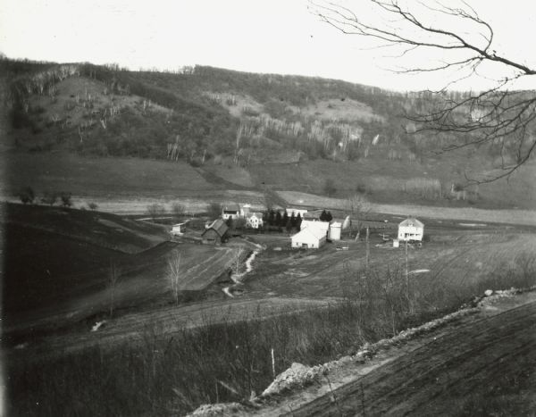 Elevated view of a farm in a valley. 
