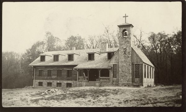 Exterior of the novitiate house of the Order of Saint Camillus, in Durwards Glen. The bell tower and chapel exterior are visible, with cross at tower apex and Chi Rho on the tower side. Caption reads: Camillian Novitiate, Durward [sic] Glen.