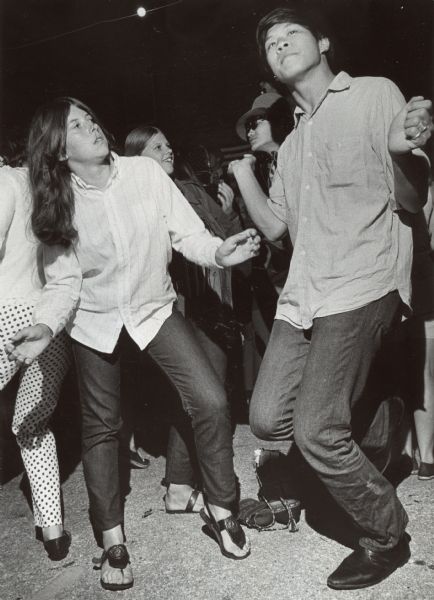 A boy and girl are dancing, with several other teenage dancers in the background. Caption reads: "Doing the "Applewood" — A rock 'n' roll dance was a Friday night highlight of the annual Cudahy Sweet Applewood festival. The Torys provided music at Washington school for Michele Heffron, 16, of 3546 E. Whitaker Av., Cudahy, and David Toy, 19, of San Francisco. The festival will end with folk dances and a concert at the school Saturday night."