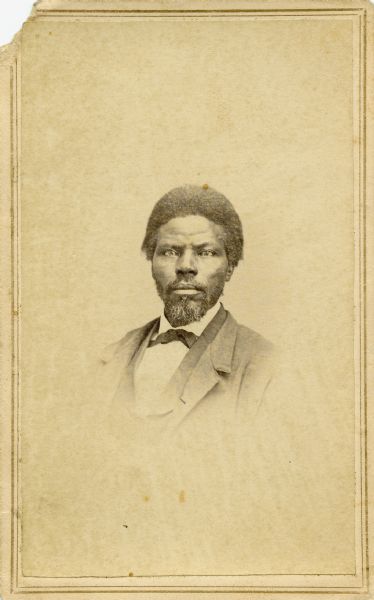 Carte-de-visite quarter-length portrait of a man wearing a suit and bow tie. Caption reads: "Pupil of my mother's in A.M.A. [American Missionary Association] schools."

The mother mentioned in the caption was Katherine Scholesser Estabrook, a Milwaukee woman who taught freedmen in Mississippi after the Civil War.