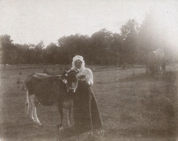 Adda Howie and her pet cow at Sunny Peak Farm.