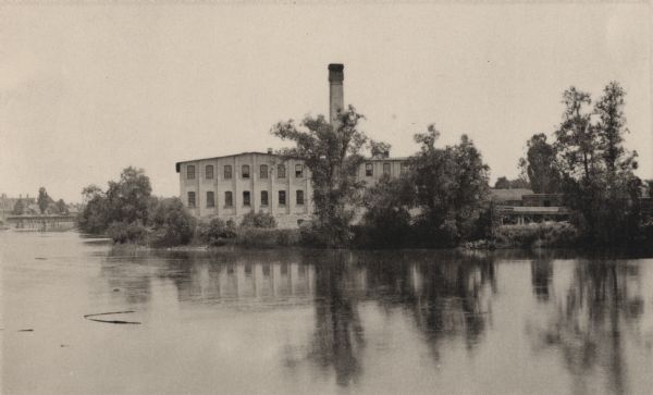 View across water towards the George Whiting Paper Mill on the Lawson Canal.