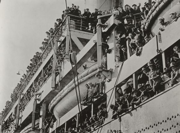 View looking up towards men of the 32nd Division aboard the steamship <i>Leviathan</i> arriving at Brest, France.